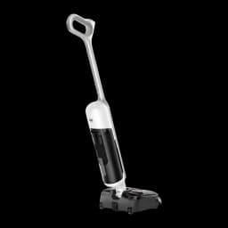 Aspiradora escoba blanca y negra sin cable con depósito frontal, asa ergonómica en arco y base ancha con cepillo y ruedas, diseño vertical compacto