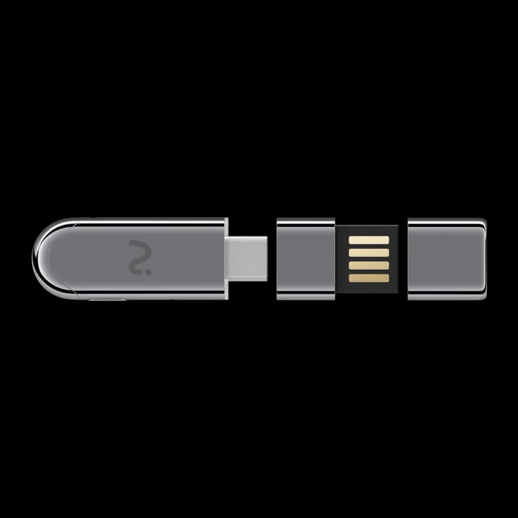 Dongle grabador IA Viaim NoteKit AI Recording Dongle en gris oscuro, compacto, con conector USB‑C y cubierta magnética; pines dorados visibles en el módulo