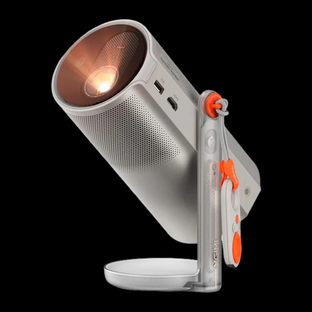 XGIMI MoGo 4 Laser Kit plateado, vista lateral: lente encendida, rejilla altavoz, puertos USB y HDMI, soporte inclinado con