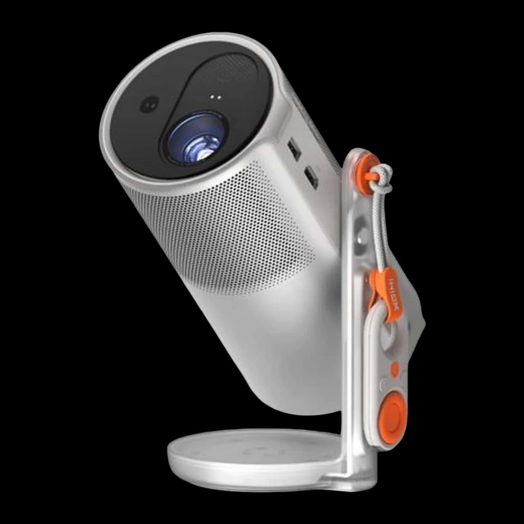 XGIMI MoGo 4 Proyector 16GB plateado, vista frontal-lateral: lente, rejilla altavoz, soporte articulado naranja y cordón