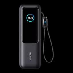 Batería portátil negra con pantalla LED que muestra 100, correa lateral y cuerpo compacto; puertos 2x USB-C y 165W, 25000 mAh para laptop y móviles