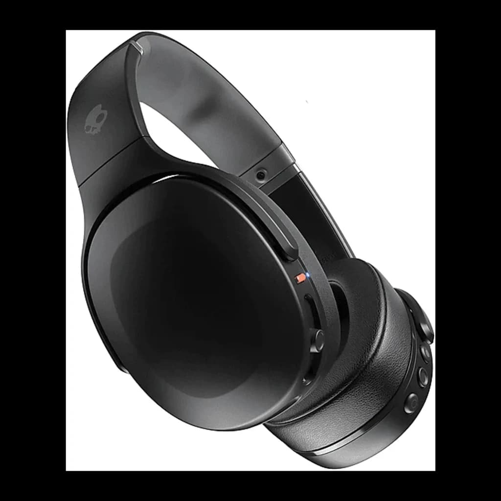 Skullcandy Crusher Wireless noir, vue latérale replié: logo crâne sur arceau, contrôles latéraux et détail orange visibles
