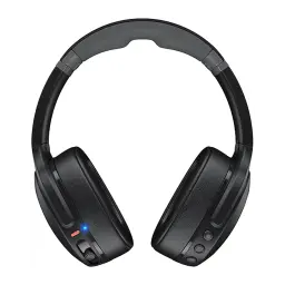 Skullcandy Crusher Wireless noir, vue de face: arceau, coussinets et LED bleue allumée sur l'oreillette gauche