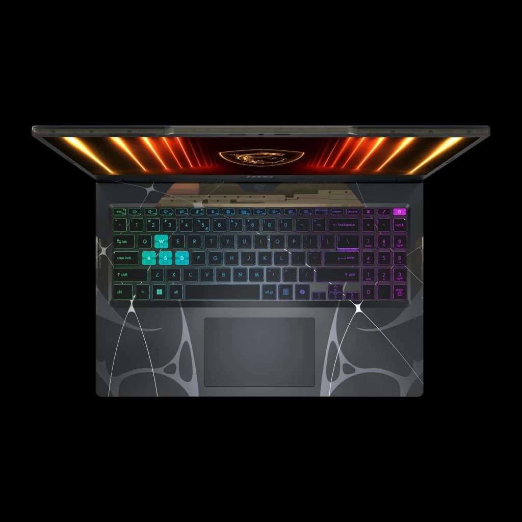 MSI Cyborg A15 1TB negro, vista superior: teclado RGB multicolor, panel trasero con luces naranja y logo MSI