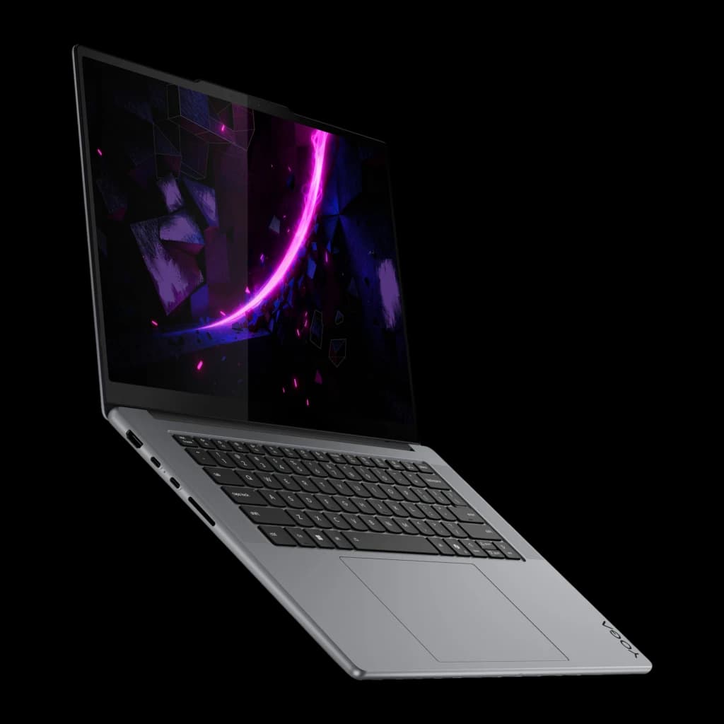 Lenovo Yoga Pro 7 15IPH11 1TB Gris, vue en angle: écran allumé avec fond néon, clavier et pavé tactile visibles sur fond