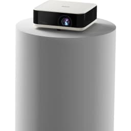 Epson V11HB72040 1080p 3LCD noir et blanc, vue avant-dessus: projecteur sur socle cylindrique gris, objectif visible