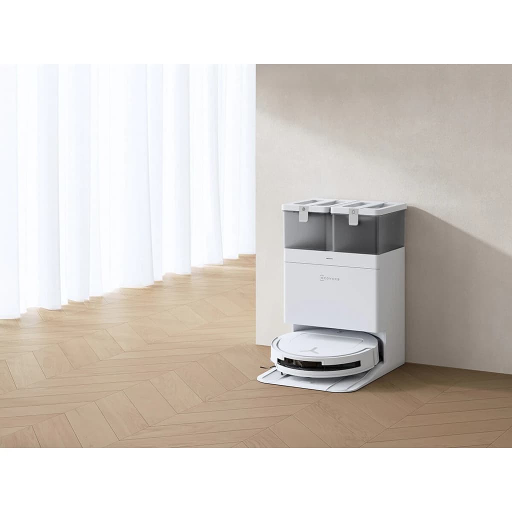 Ecovacs Deebot T50 Pro Omni Gen 2 blanco, vista lateral: robot acoplado a base omni con depósitos grises sobre suelo