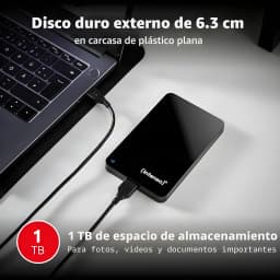 Intenso Memory Drive 1TB preto, vista em uso: disco ligado por USB a portátil sobre superfície cinza