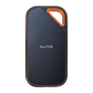 SanDisk SSD Extreme Pro V2 4TB negro naranja, vista frontal: superficie texturizada con puntos, asa naranja en esquina
