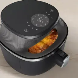 Philips Airfryer Serie 3000 7,2 l Negro Cobre, detalle: ventana interior iluminada con pollo dorado y panel táctil digital