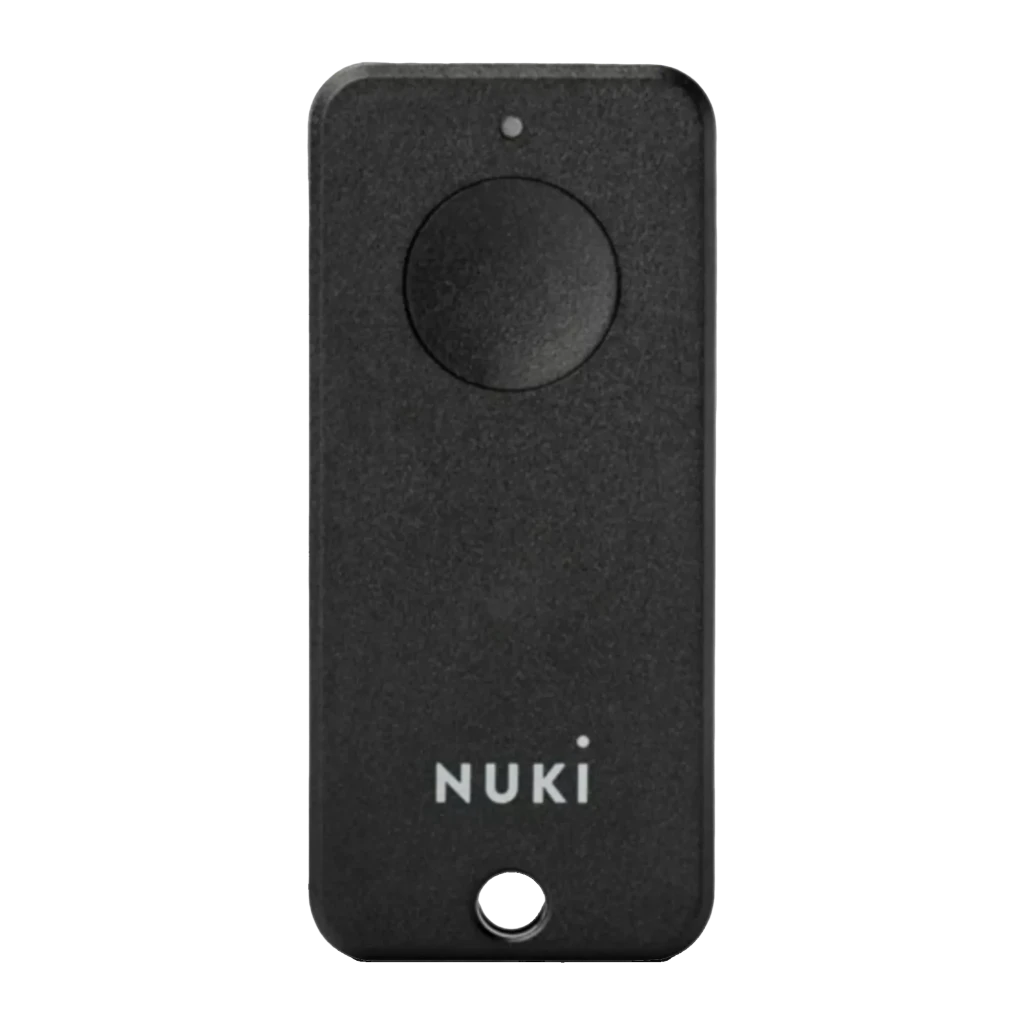 Chave de acesso Nuki Fob Bluetooth 1 botão em preto fosco, formato retangular, grande botão circular superior, LED indicador e furo para chaveiro na base