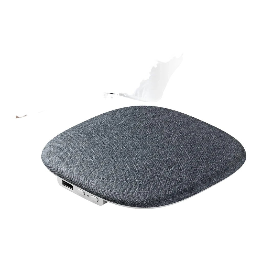 Enceinte oreiller gris compacte en tissu, coins arrondis, commande latérale et port USB-C visibles, design plat pour lit, compatible Bluetooth 5.4 autonomie 8