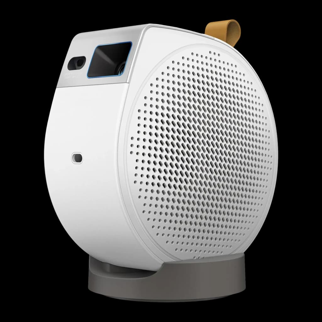 BenQ Videoproyector GV50 500lm 1080p Blanco, vista frontal-lateral: cuerpo redondo, rejilla altavoz, lente y asa cuero