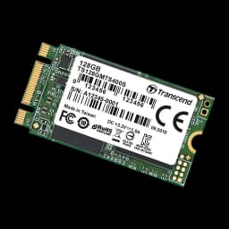 Transcend MTS400 128GB M.2, vista em ângulo diagonal: placa verde inclinada, etiqueta branca e borda lateral visíveis