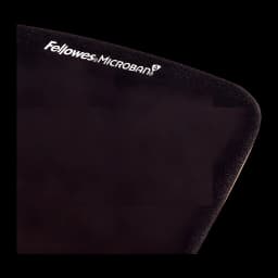 Fellowes PlushTouch Negro, detalle esquina superior: logo Fellowes Microban en superficie texturizada y borde acolchado