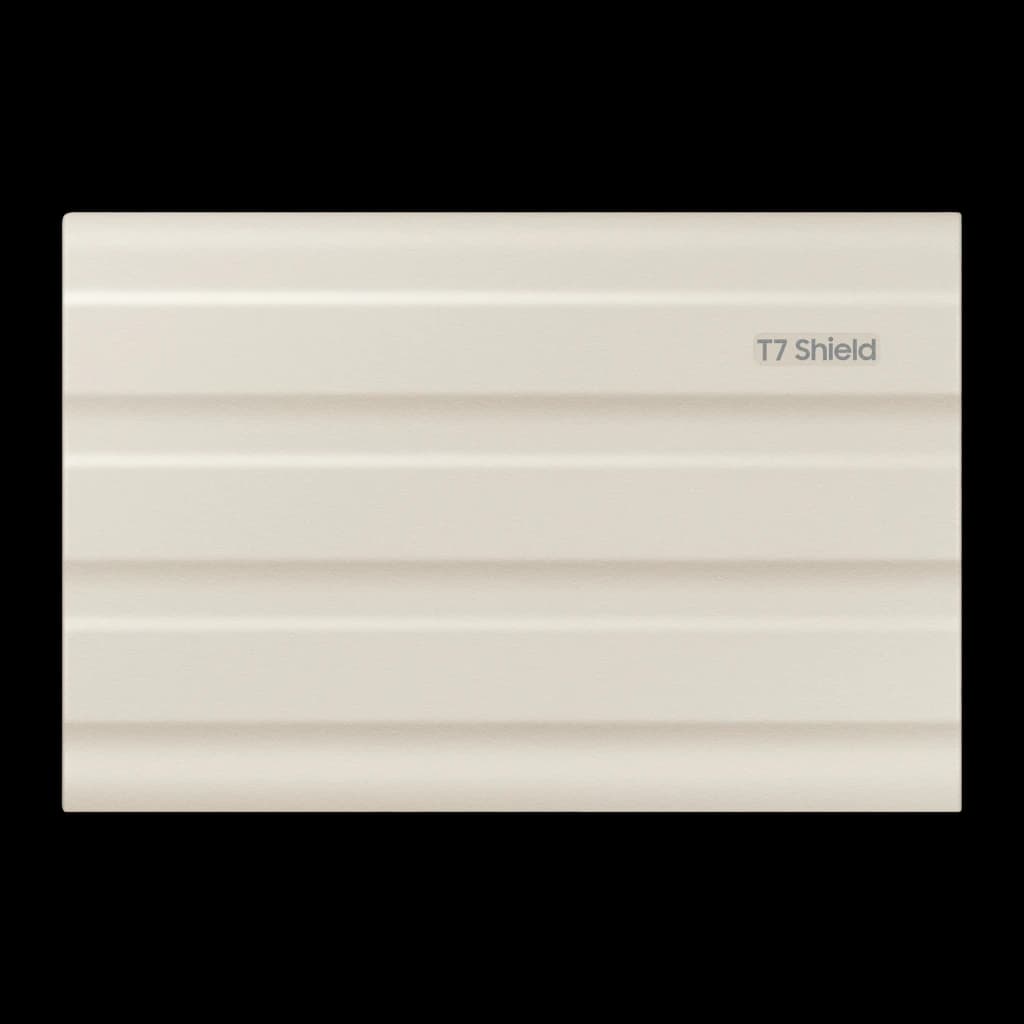 Samsung T7 Shield 2TB Beige, vue arrière à plat: surface rainurée beige avec logo T7 Shield dans le coin