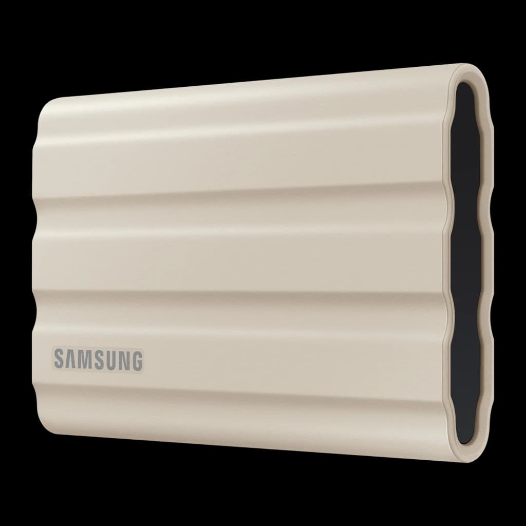 Samsung T7 Shield 2TB Beige, vue latérale en angle: coque rainurée beige avec embout noir sans port visible