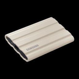 Samsung T7 Shield 2TB Beige, vue supérieure en perspective: coque rainurée beige à plat montrant port USB-C et LED