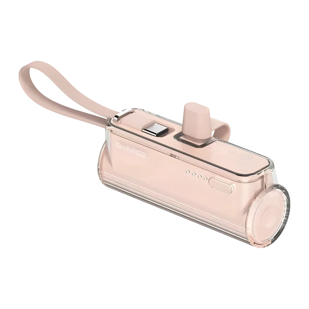 Batterie rose compacte transparente 5000 mAh, câble USB‑C intégré, indicateurs LED, bouton latéral et dragonne assortie, design cylindrique élégant