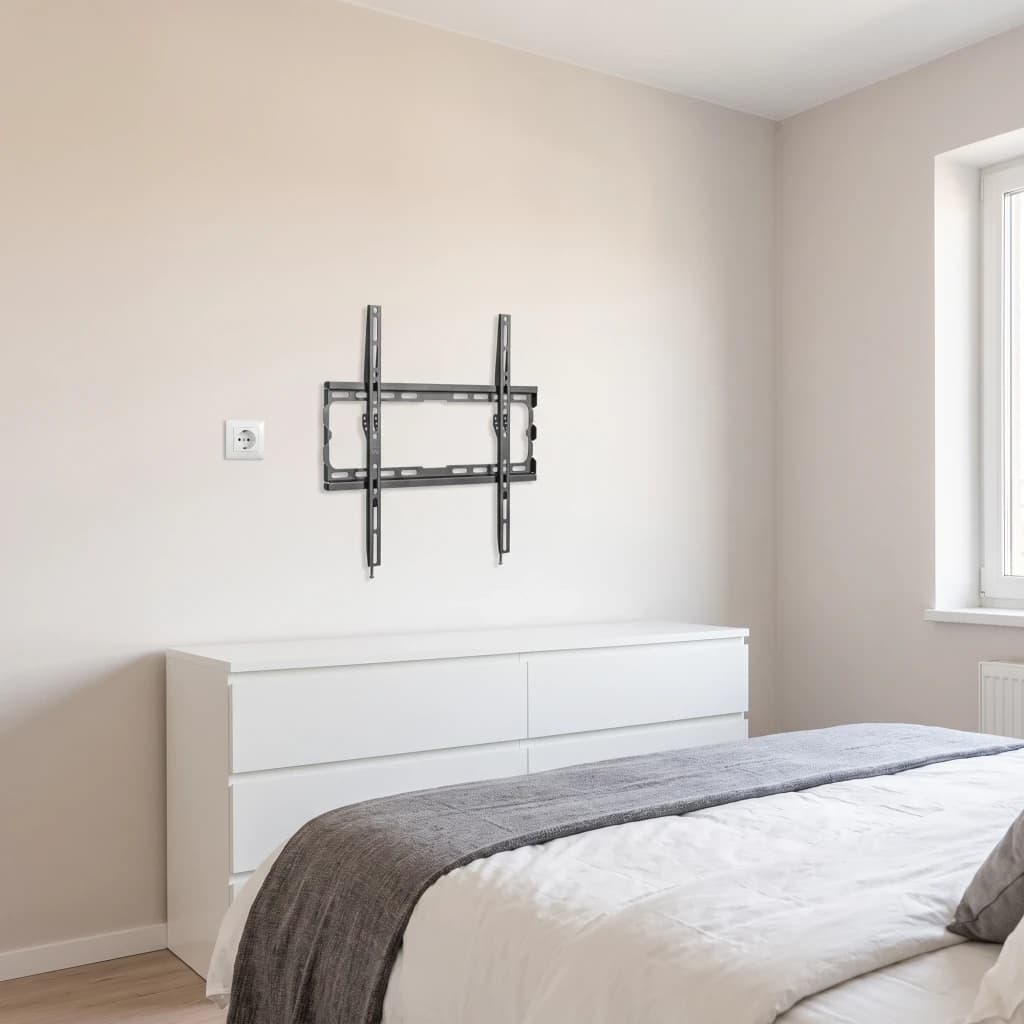 Support TV Ewent Noir Mural Fixe 32-70 pouces EW1502, en situation: fixé au mur d'une chambre au-dessus d'une commode