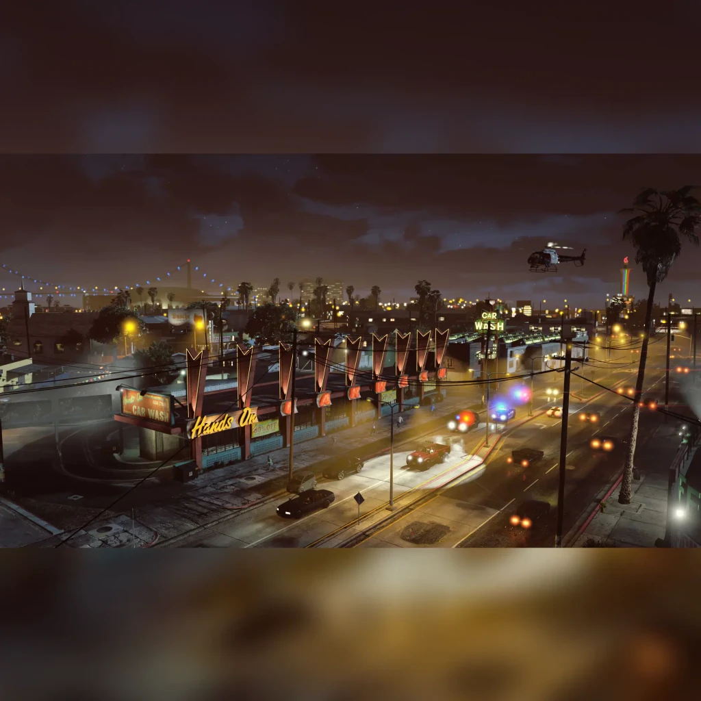 Videojogo Rockstar Games Grand Theft Auto V Xbox Series X, em uso: cena noturna com car wash, carros de polícia e helicóptero