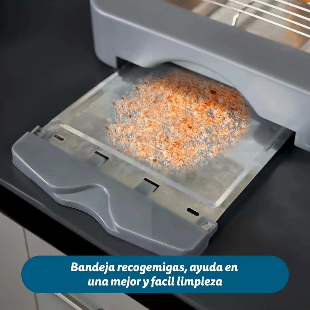 Tostadora Grunkel 300W 2 rebanadas Gris TSP-MINISIZE, detalle: bandeja recogemigas extraída con migas sobre superficie negra