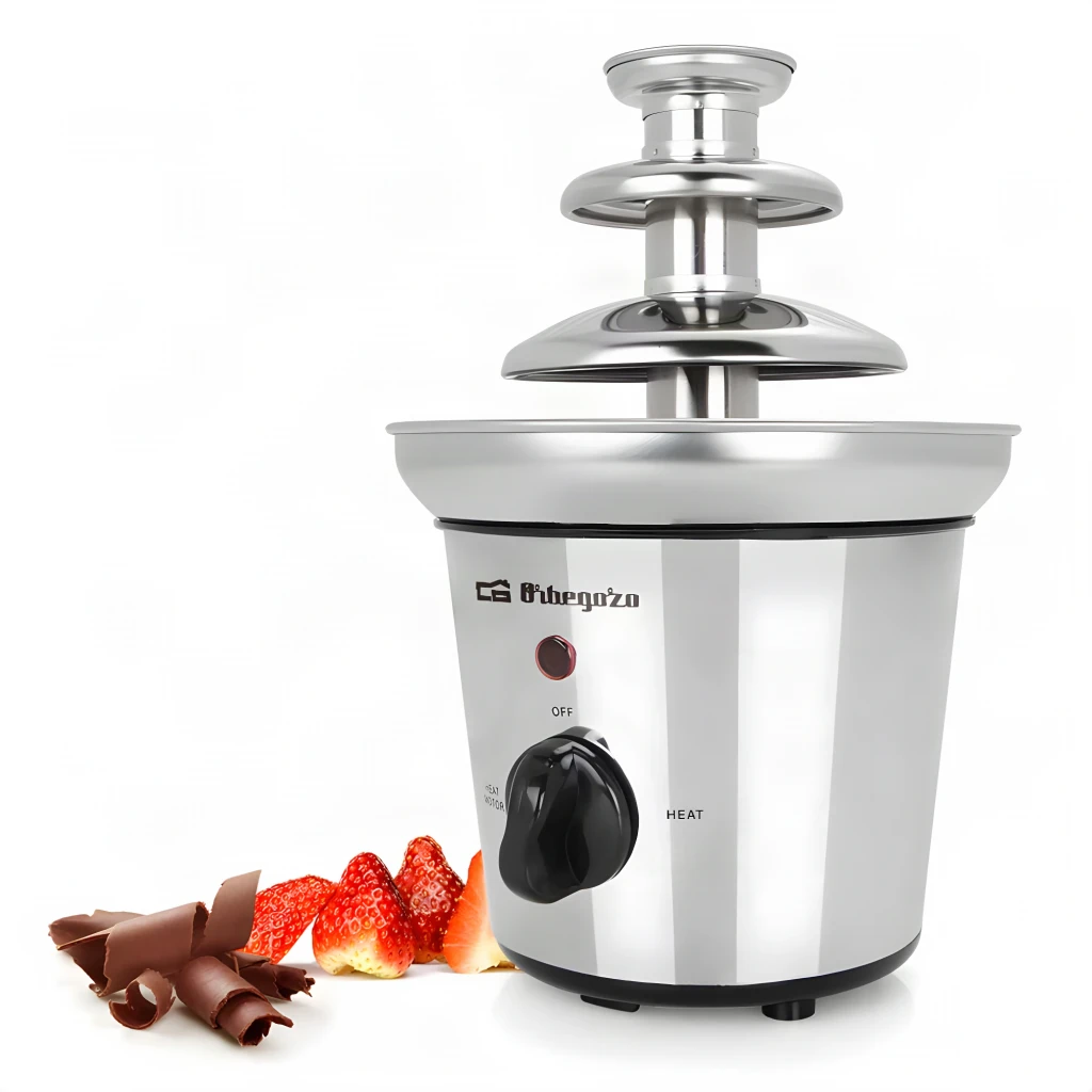 Fuente de chocolate Orbegozo FCH 4000 1L 40W, en uso: torre de 3 niveles en acero, mando OFF/HEAT y fresas con virutas