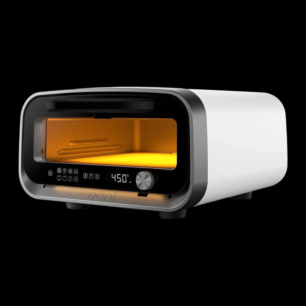 Four à pizza électrique Ooni Volt 2 1600W Blanc, vue de face: intérieur lumineux orange, panneau tactile et molette à 450°