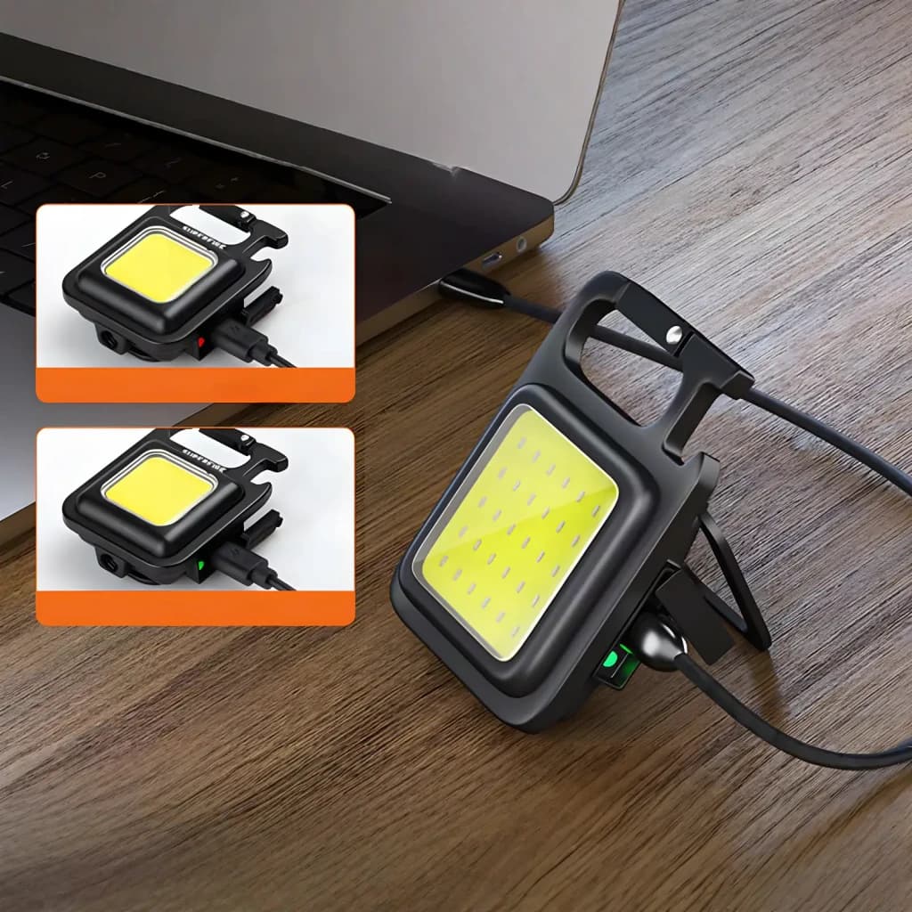 Lampe de poche LED Superfire MX16 Noir Rechargeable USB-C 600 lumens, en utilisation: en charge près d'un laptop, panneau