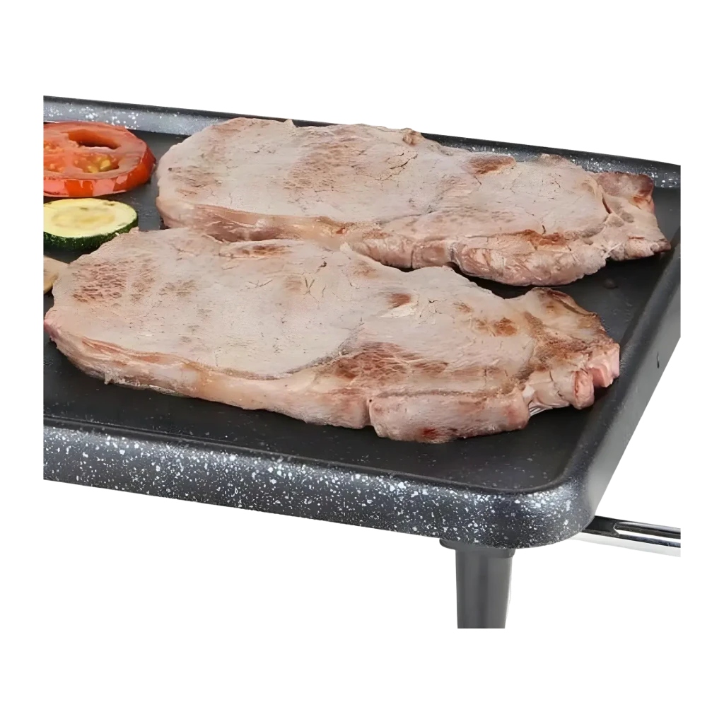 Barbacoa eléctrica Orbegozo 2200W 430x220mm Negro TBC 3000, detalle: plancha antiadherente con chuletas y verduras a la brasa