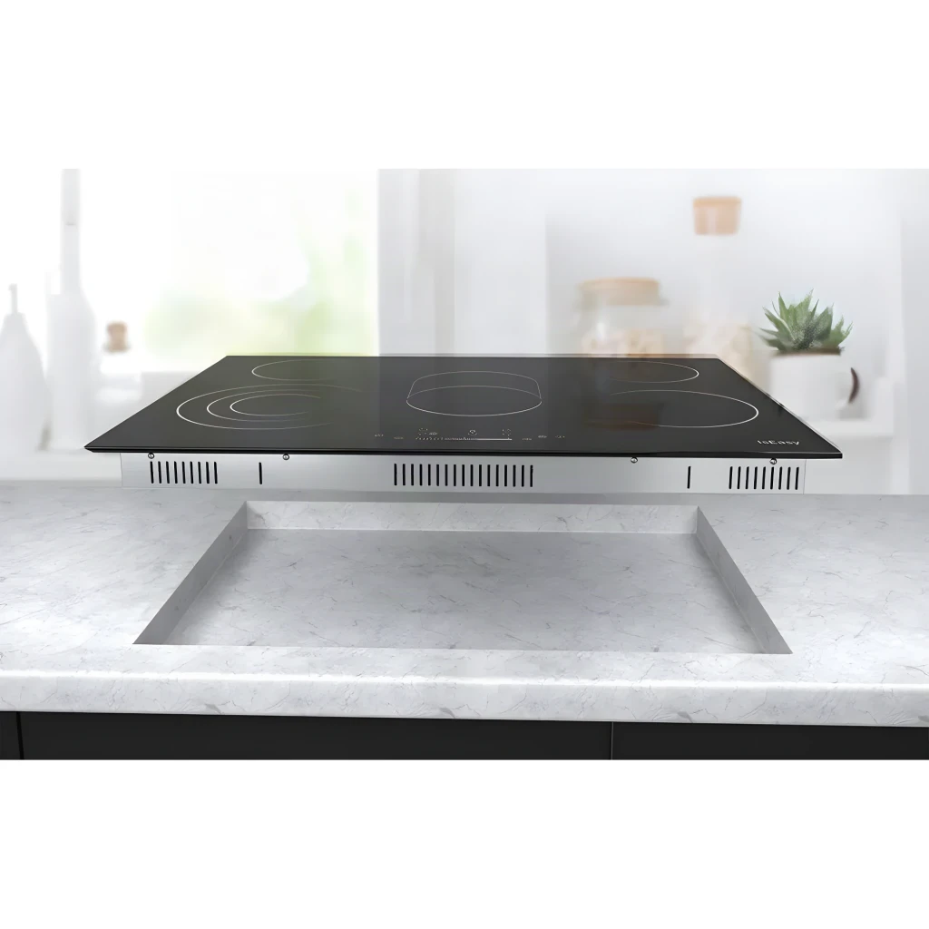 Placa Vitrocerámica IsEasy 2400W máx por zona Negro LT5-02, detalle: instalación encastrada en encimera de mármol, marco