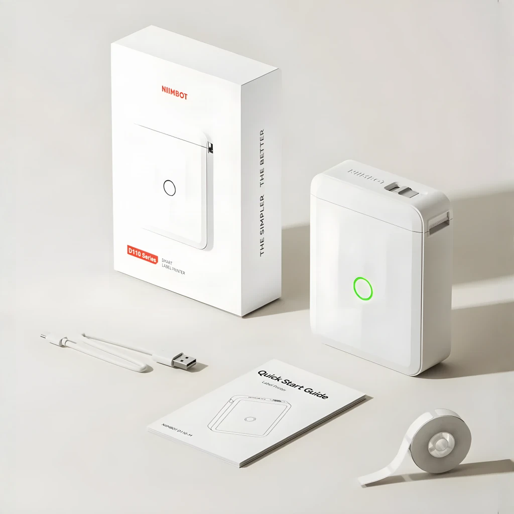 Impresora de etiquetas portátil Niimbot D110M Bluetooth Blanco, en uso: contenido de la caja con dispositivo, rollo