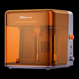 Graveur Laser Creality Falcon A1C Gris 5W, vue avant 3/4: capot orange translucide, tête laser intérieure et bouton d'arrêt