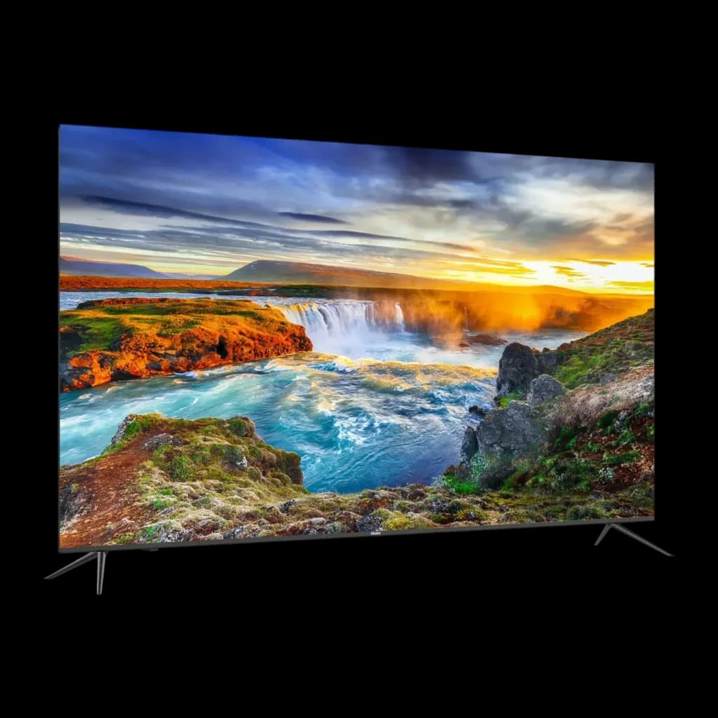 TV Haier 32 pouces LED Full HD Noir H32K702FG, vue latérale: écran allumé avec paysage de cascade et bordure ultra-fine