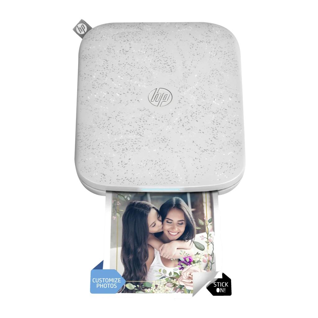 Imprimante photo portable Liene PixCut S1 Pix Cut 2 en 1 Blanc, vue avant: photo en cours d'impression avec bordure florale