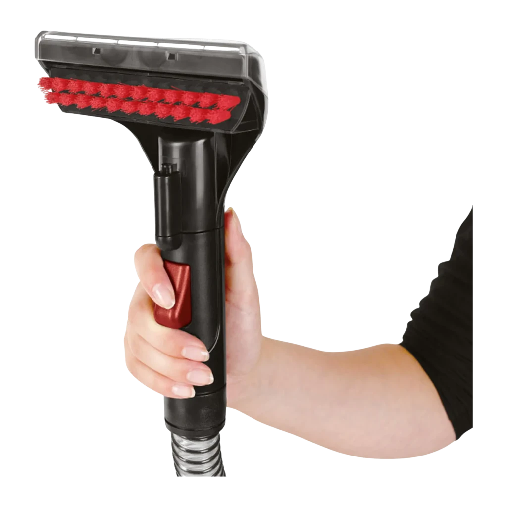 Nettoyeur de taches BISSELL SpotClean Pro 1558N 750W câble 6,7m, détail: main tenant la buse brosse rouge avec gâchette rouge