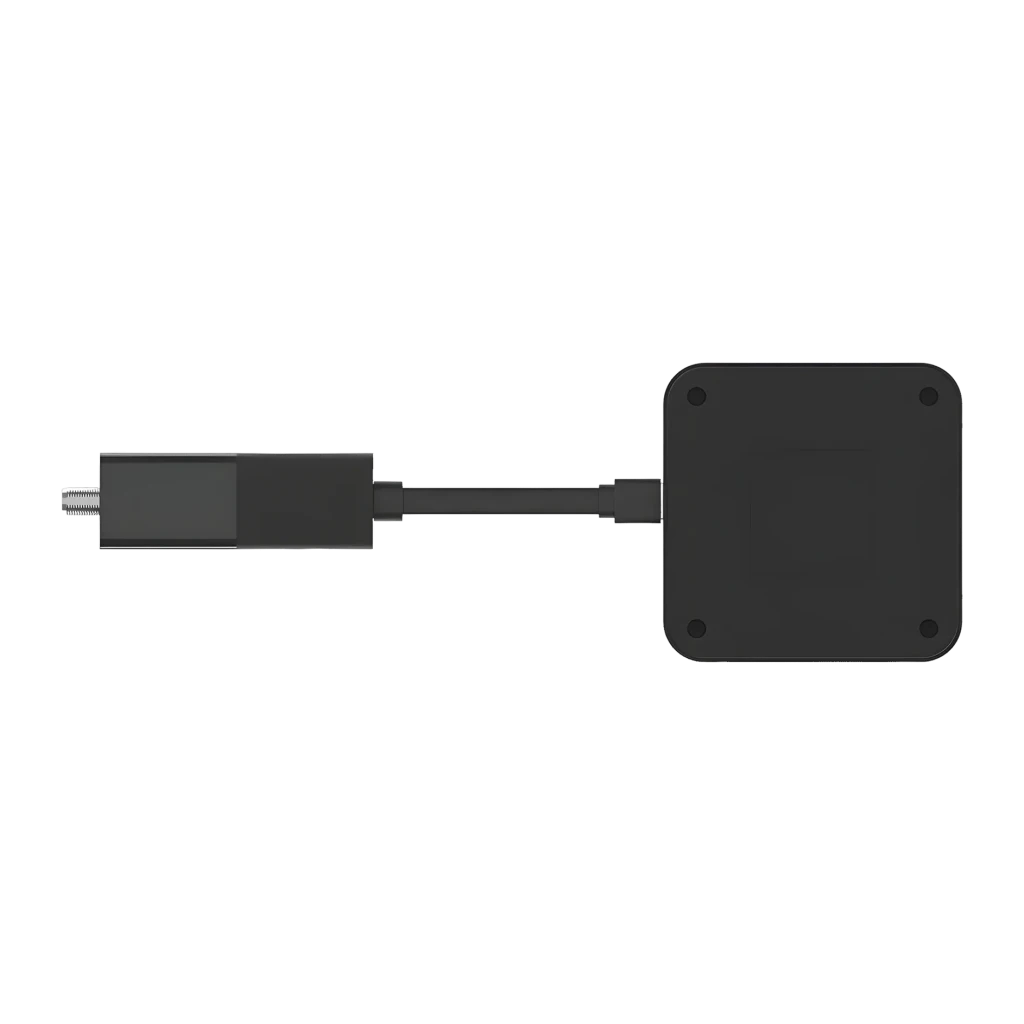 Reproductor Multimedia Strong SRT427 4K UHD Google TV, vista inferior: base negra con tornillos y dongle HDMI conectado