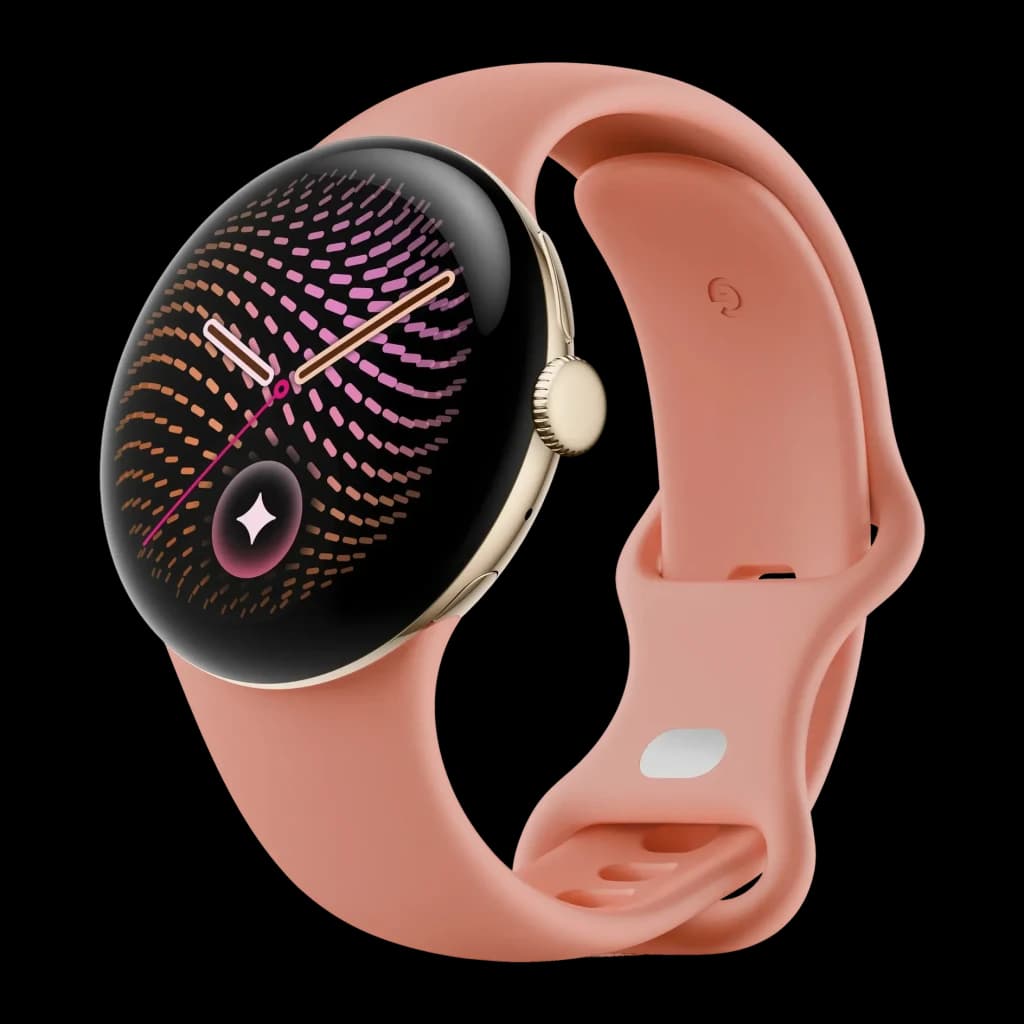 Google Pixel Watch 5 41mm Dorado NFC, vista en ángulo: caja dorada, corona lateral y correa de silicona rosa salmón