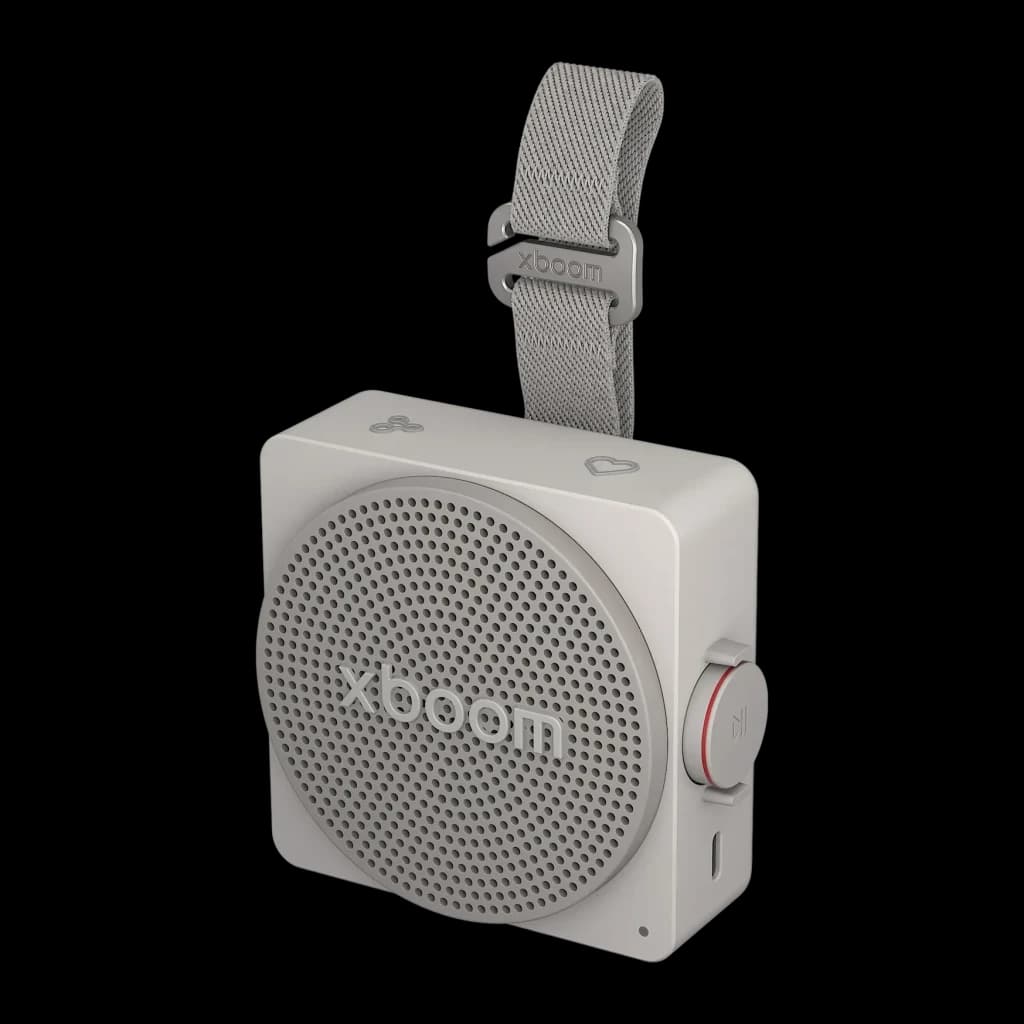 Altavoz portátil LG xboom Mini by will.i.am IP67 5W 10h Gris, vista frontal en ángulo: rejilla circular, correa textil