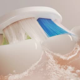 Tête de Brosse à Dents Philips Sonicare Optimal White Pack 6 HX6066/87, gros plan: soies blanches et bleues en action