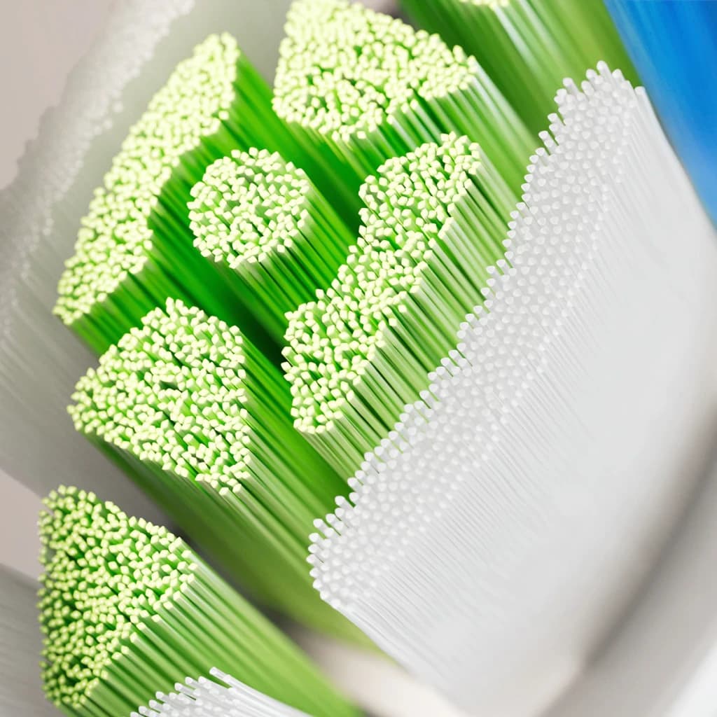 Tête de Brosse à Dents Philips Sonicare Optimal White Pack 6 HX6066/87, détail macro: soies vertes et blanches aux pointes