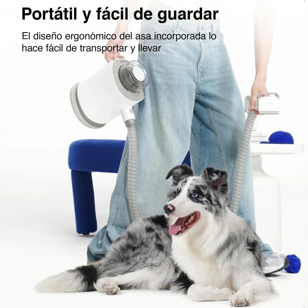 Kit de aseo Neakasa P0 Pro Blanco, en uso: persona sostiene la unidad por el asa ergonómica junto a un perro Border Collie