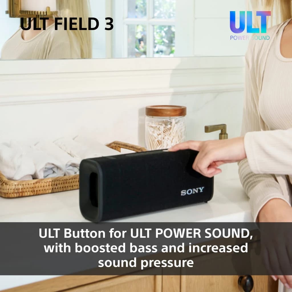 Enceinte portable Sony ULT Field 3 IP67 27W 24h Bluetooth 5.2 noire, en utilisation: femme la touchant sur un plan de salle