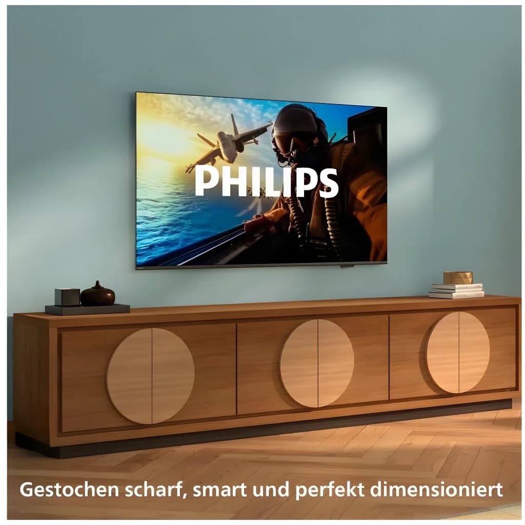 TV Philips 65 pulgadas LED 4K UHD HDR10+ Negro 65PUS7001/12, vista frontal: montado en pared sobre mueble de madera