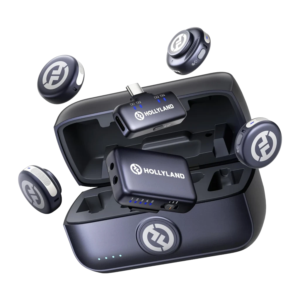 Estuche gris espacial con puerto USB-C que carga transmisores y receptores Hollyland Lark M3; incluye 4 TX y 2 RX compactos con luces LED y logotipo circular