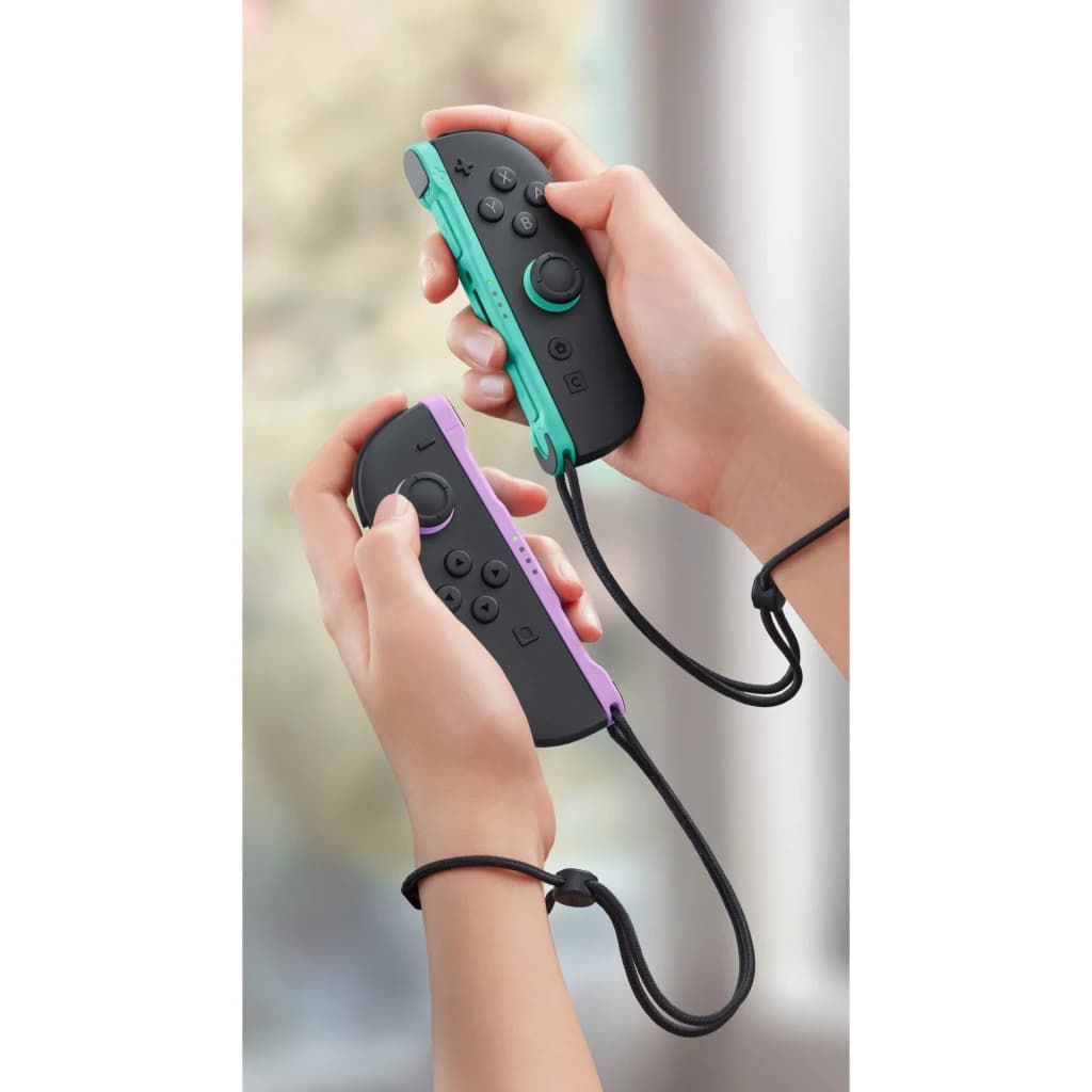 Manette de jeu Nintendo Joy-Con 2 Vert clair et Violet Sans fil - deux mains tiennent chaque manette