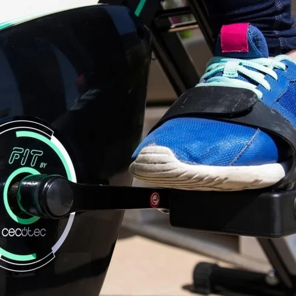 Bicicleta de exercício dobrável X-Bike com pedal ergonômico, cinta ajustável e braço de manivela robusto em acabamento preto com detalhes verdes