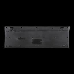 Parte traseira do teclado Hama Cortino sem fios: base preta, apoios rebatíveis, compartimento de pilhas e pés antiderrapantes, layout Espanhol RF 2.4GHz