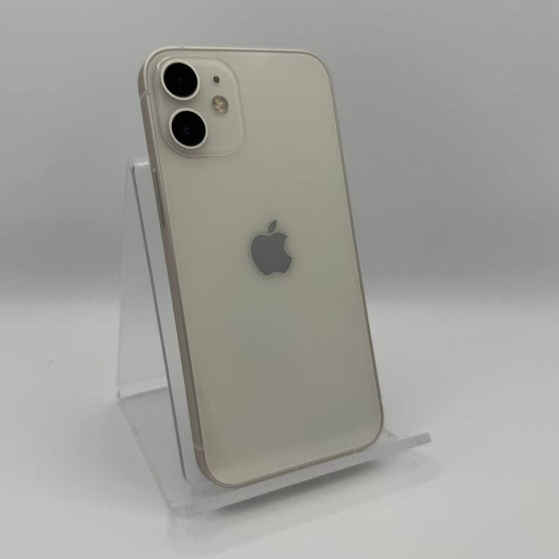 iPhone 12 Mini 128GB blanco renovado en estado excelente, trasera brillante con doble cámara y bordes planos, logo Apple centrado, soporte acrílico