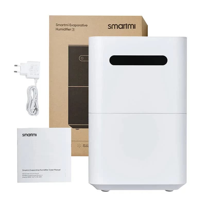 Xiaomi Smartmi Evaporative Humidifier 3 Umidificador branco minimalista com visor preto, corpo em duas partes, fonte de alimentação e manual ao lado da caixa